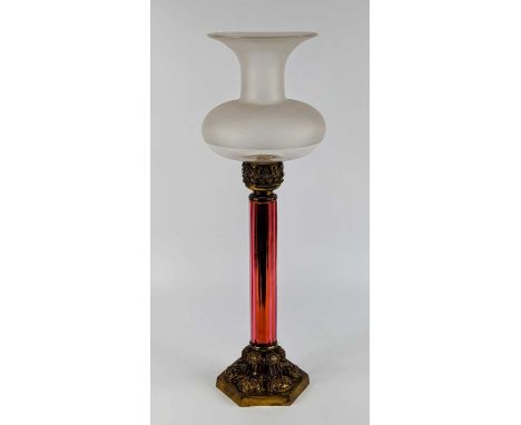 A French brass and glass table lamp, 19th century, the frosted glass shade above a cranberry glass stem and relief decorated 