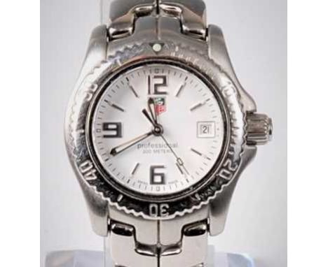 A lady's Tag Heuer Link Professional quartz wristwatch, the white dial with Arabic and baton numerals, seconds markers, calen