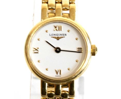 A lady's Longines Prestige 18ct yellow gold quartz wrist watch with round ¼ Roman dial and integral tapered brick link bracel