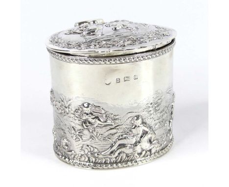 A late Victorian silver tea caddy, of cylindrical form with hinged cover and gilt-washed interior, all-over repousse decorate