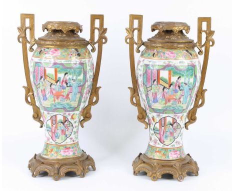 A pair of Chinese Canton porcelain vases, 19th cenury, of inverse baluster form, having European gilt metal mounts, each enam
