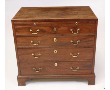A George III mahogany chest having a caddy top (probably replacement) above a brushing slide and four long graduated cock bea
