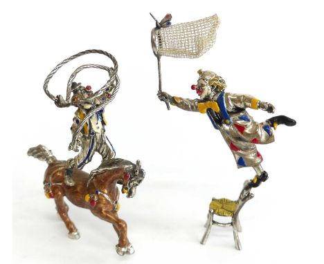 A pair of late 20th century Italian silver and enamel clown figures, being a butterfly catcher balanced upon the back of a ch