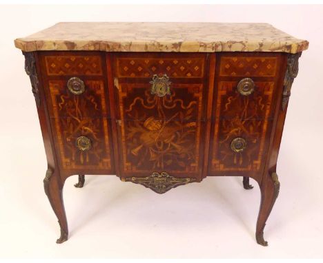 A French mahogany rosewood and satinwood inlaid transitional style commode, early 20th century, gilt metal mounted, with roug