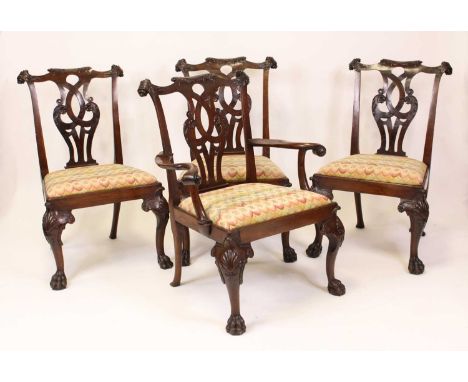 A set of eight mahogany dining chairs in the Chippendale taste, circa 1900, each having swept acanthus leaf capped scroll rai