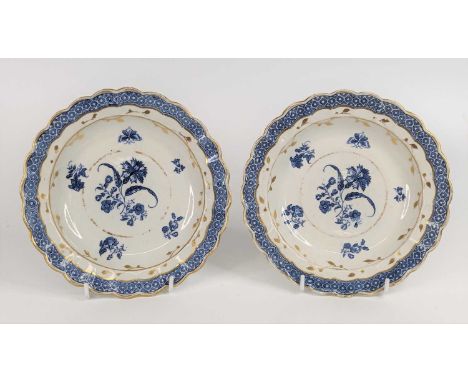 A pair of Caughley porcelain plates, circa 1785, each decorated with flowers and heightened in gilt, rare impressed Salopian 