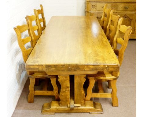 A good heavy trestle end oak pine refectory table, 76cm high, 200cm long, 89cm wide; together with a set of six ladder back c