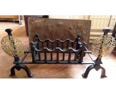 Georgian style cast iron dog grate with pierced brass decoration complete with back bearing Cheshire coat of arms. Condition 