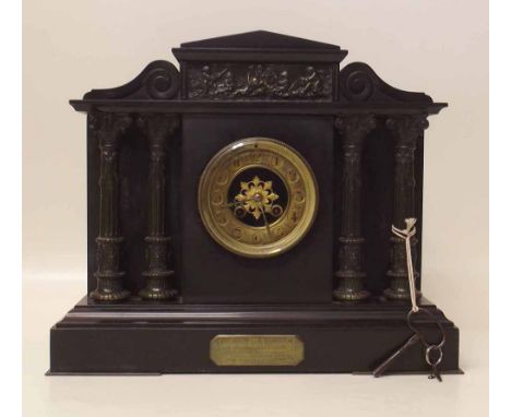 Black slate mantel clock. Condition report: see terms and conditions.