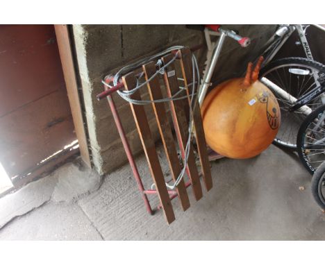 A metal and wooden slatted sledge