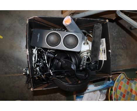 A box containing various microphones, headphones, Amazon Basic speaker etc.