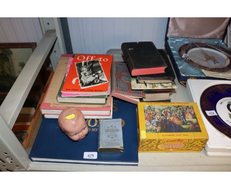 A vintage jigsaw puzzle, Mexican card game, various books to include an atlas, vintage dolls head etc. 