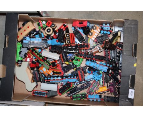 A box containing Thomas the Tank Engine models etc. 