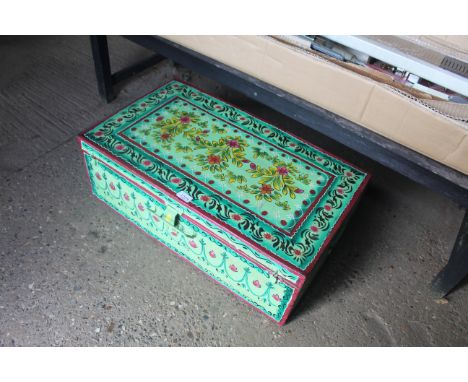 A large decoupage tin trunk