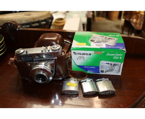 A Kodak Retinette camera, Fujifilm camera and three Ronson lighters