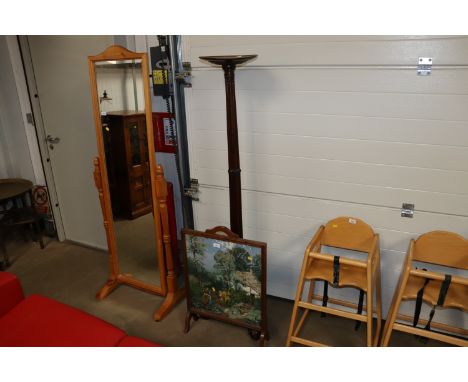 A mahogany torchere stand raised on tripod base and an oak framed fire screen