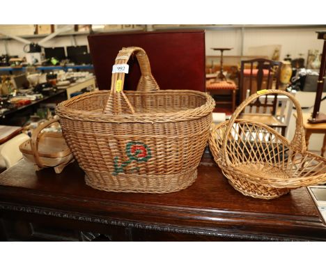 Two wicker baskets and a trug