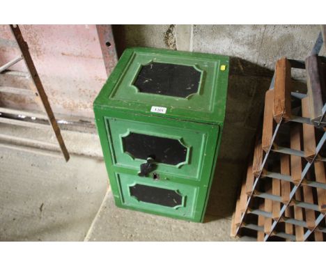 A small vintage cast iron safe, with key