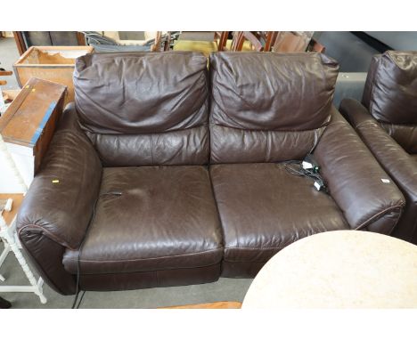 A brown leather upholstered electric reclining two seater settee