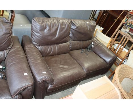 A brown leather upholstered electric reclining two seater settee