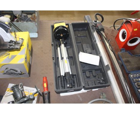 A boxed rotary laser level, with instruction manual