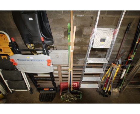 A quantity of garden tools; to include rake, lawn spiker etc.