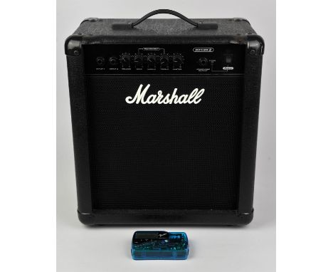 A 25 W Marshall practice amplifier and a fender guitar tuner.