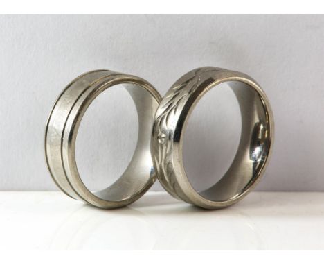 Two Titanium rings size X and Y respectively.
