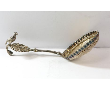 Victorian silver caddy or wine spoon, London 1897 with embossed decoration bowl and bird on handle.