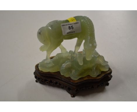 A modern jade horse and foal ornament on hardwood stand 