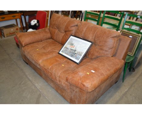 A brown leather two seater sofa