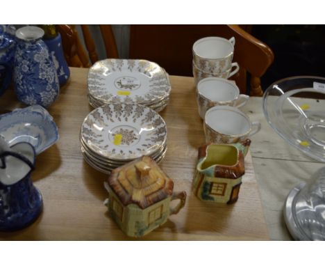 A quantity of gilt decorated tea cups and saucers with matching side plates and a cottage ware cream jug and sugar bowl