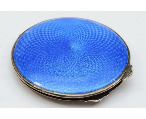 A silver a guilloche enamel powder compact, Birmingham 1934, lacking powder puff, 63mm 