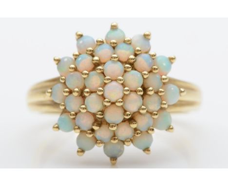 A 9ct gold and opal cluster ring, diameter 16mm, T, 4gm 