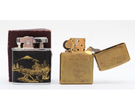 Penguin, a Japanese petrol lighter with Mount Fuji lacquer decoration, Omega Superlighter box, together with a Zippo brass li