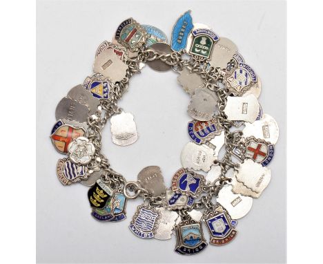 A vintage silver and enamel town crest charm bracelet, 81gm 