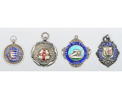 Four silver and enamel fobs, Yarmouth &amp; Gorleston Wheeler, Enfield Athletic Club, Yorkshire Amateur Swimming Assoc and C 