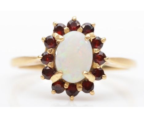 A 14K opal and garnet cluster ring, P, 2.5gm 