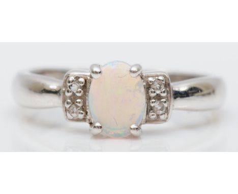 A 9ct white gold opal and CZ ring, N, 3.1gm 