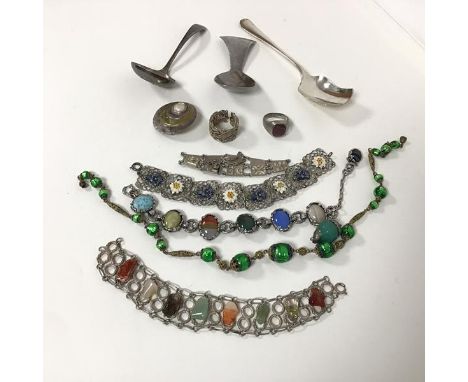 A collection of costume jewellery including a bracelet with polished stones, a bracelet with painted metal flowers, a wirewor