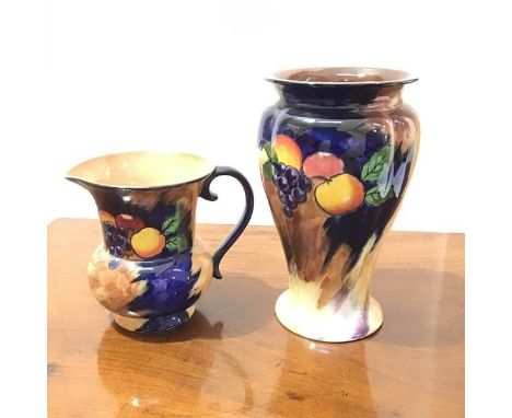 An H &amp; K Tunstall baluster shaped vase in Autumn pattern (h.22cm x d. 14cm), with a jug of the same pattern (2)