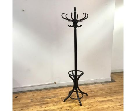 A modern black painted bentwood hat and coat stand, the reeded finial and turned shaft with scroll hooks and stick hoop, rais