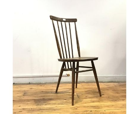 A set of four1960s Ercol stick back chairs, the plain top rail supported by turned spindles, stamped with the British Standar