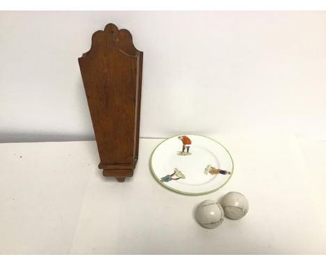 A 1930s W. Sons Golf Series plate, depicting Two Gentlemen and a Lady Playing Golf, together with two early golf balls and a 