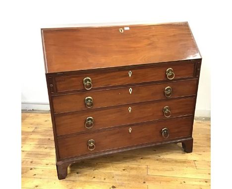 A late George III mahogany bureau, c.1800, the rectangular fall front enclosing  a fitted satinwood interior of drawers and p