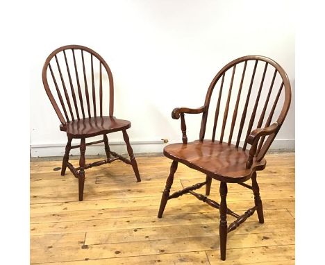 A set of ten cherrywood stick back chairs, to include a pair of armchairs, each hoop shaped back supported by turned spindles