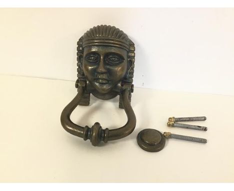 A patinated iron door knocker in the form of an Egyptian Pharoah (h.17cm x 9cm)