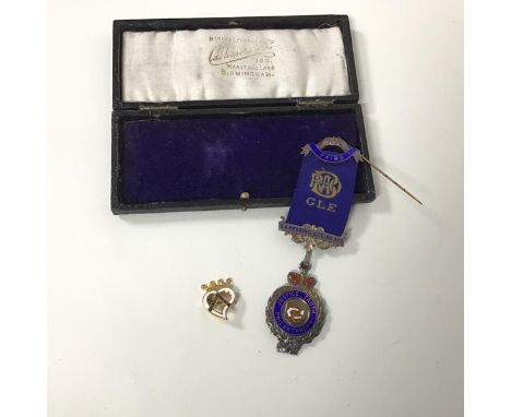 A 1920s Birmingham silver presentation medal with enamel to front and inscribed Justice, Truth, Philanthropy and inscribed ve