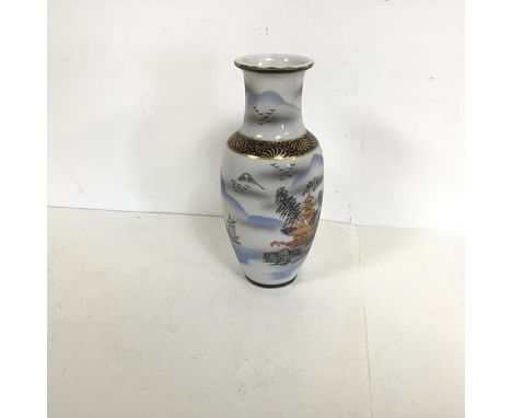 A Japanese glass vase of baluster form with gilt and painted decoration depicting pagodas and a landscape scene (h.21cm x d.9