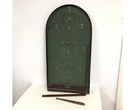 An early 20thc bagatelle game, stamped Oak Tree, complete with cue and eighteen metal balls (h.4cm x 39cm x 76cm)
